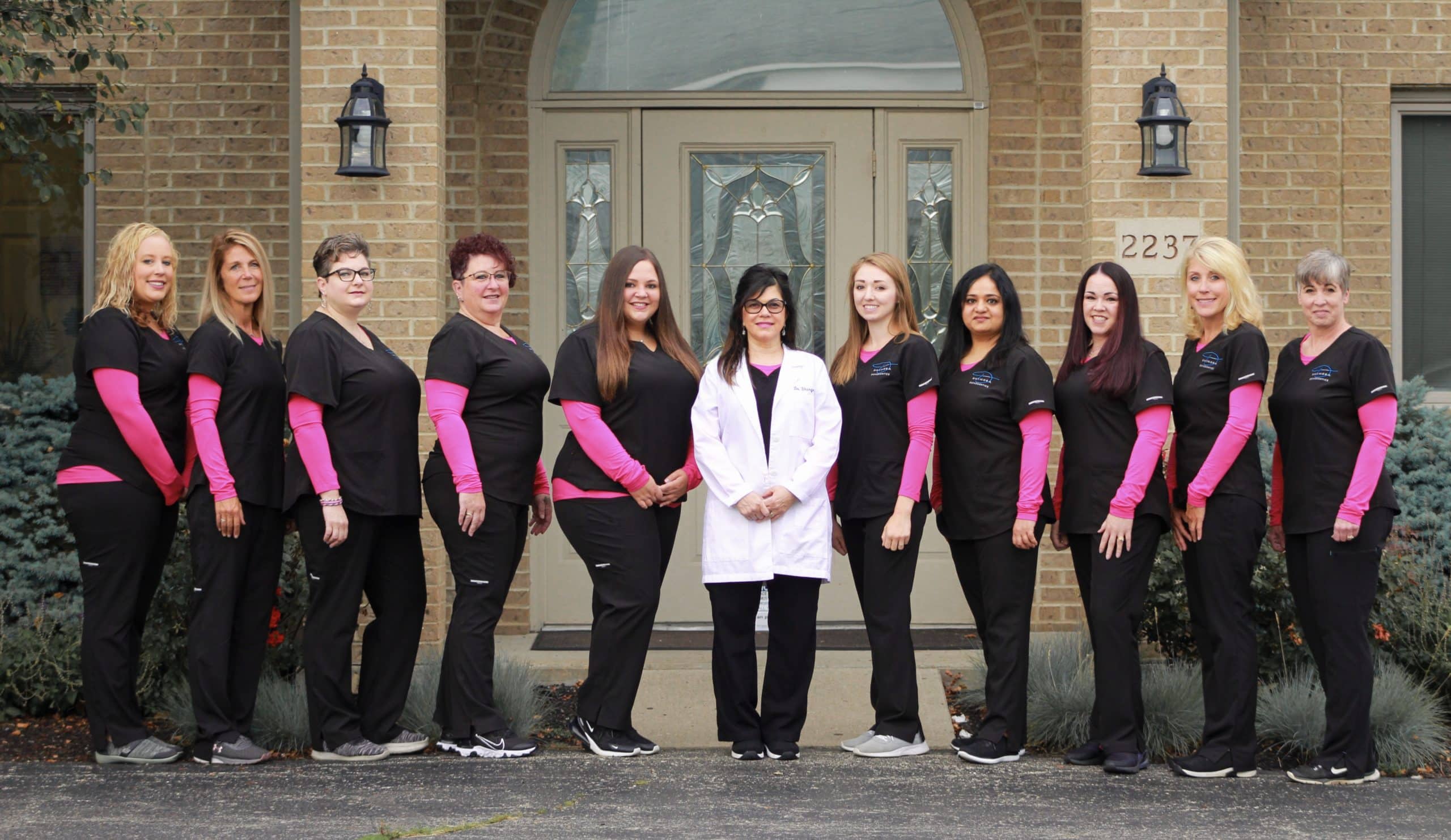 a group picture of all of the team at Dhingra orthodontics