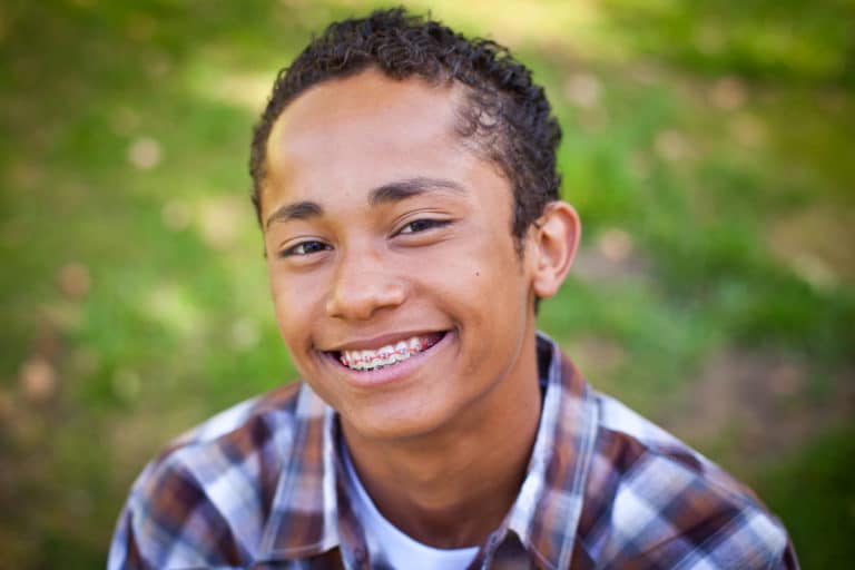 smiling African-American boy with braces