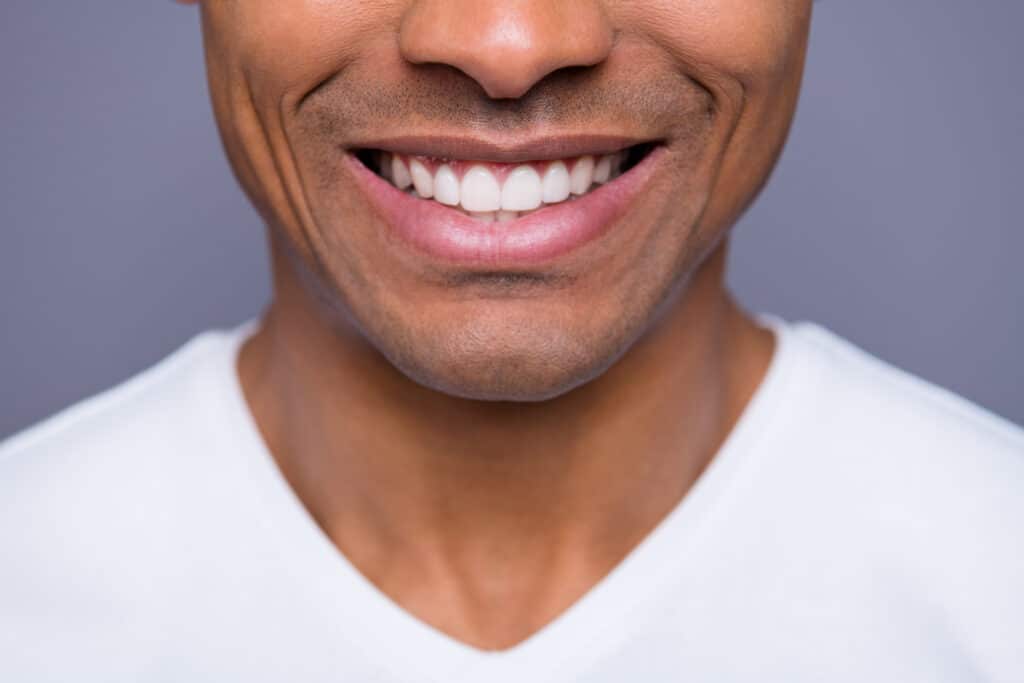 Close up of the smile of a photogenic middle aged man