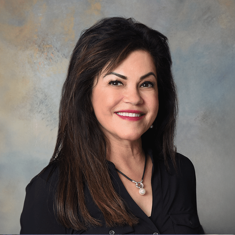 Springfield, Beavercreek, and Bellefontaine Ohio orthodontist Dr. Seema Dhingra in a black blazer