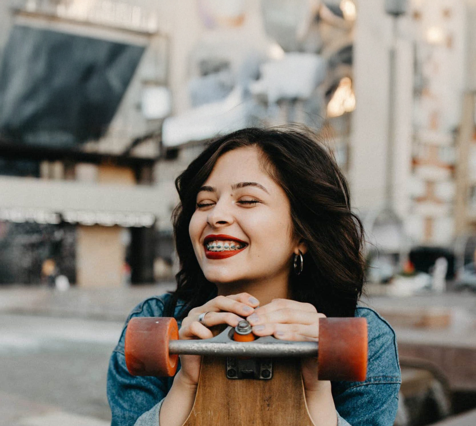 Braces in Springfield, Beavercreek and Bellefontaine, OH - Beautiful young urban girl with longboard